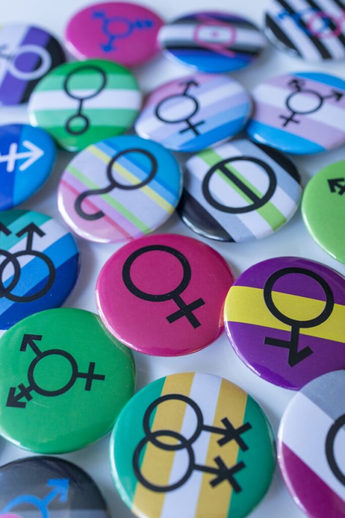 A pile of different colored and black and white buttons