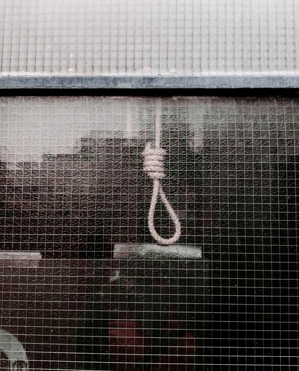 a close up of a window with a rope attached to it